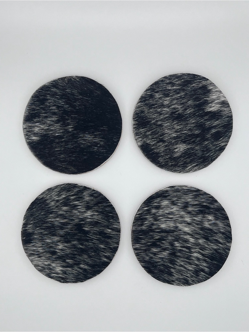 Black & White Cowhide Round Coaster Set – 4-Pack